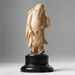 Soapstone carving of an immortal, possibly Zhongli Quan, on ebonised wooden base, includin...