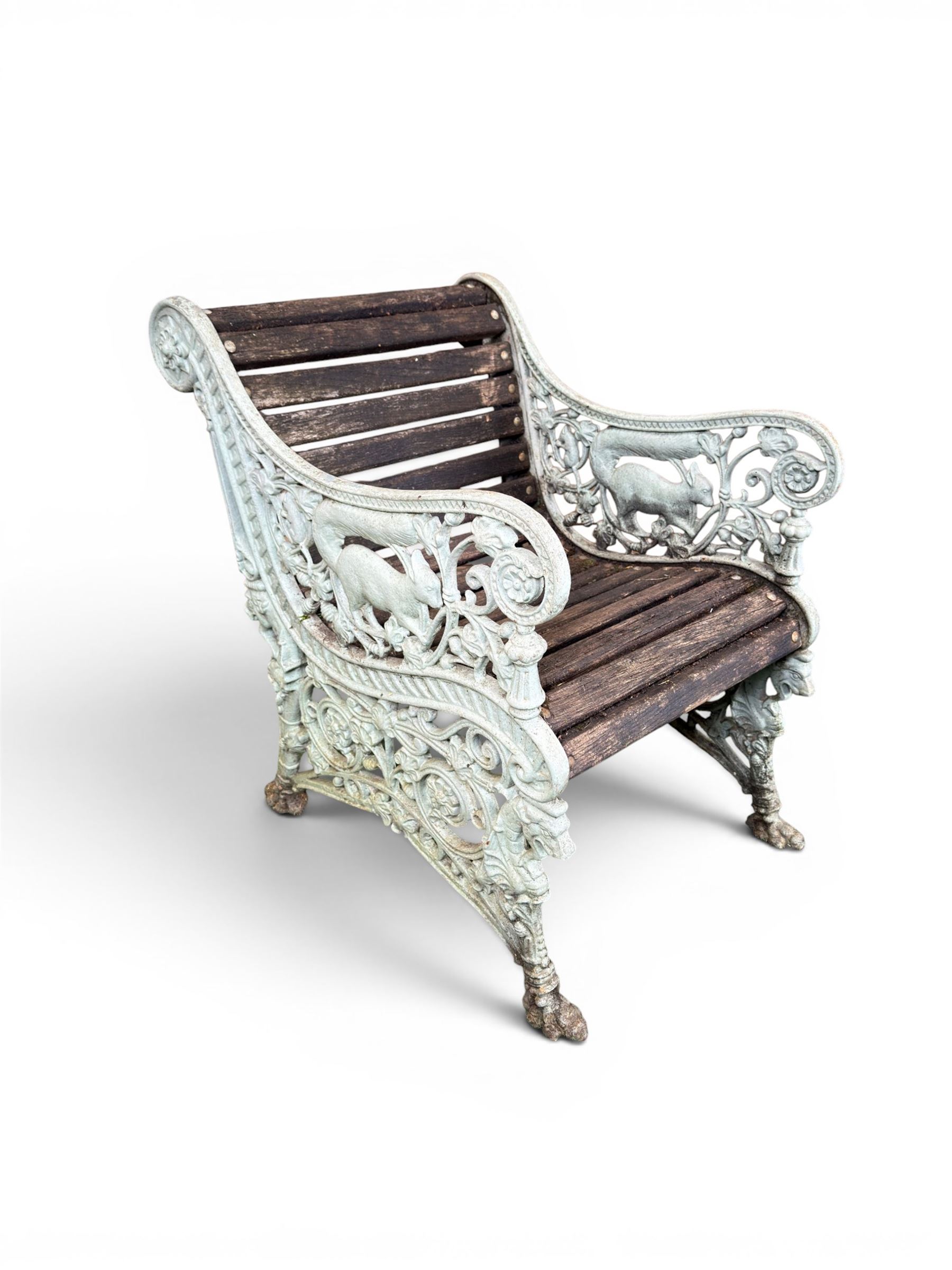Pair of unusual Victorian revival heavy cast iron garden chair benches, ornate scrollwork detail with squirrels and nature, serpentine wood slatted seat and back - design by George Smith at the Sun Foundry, Glasgow