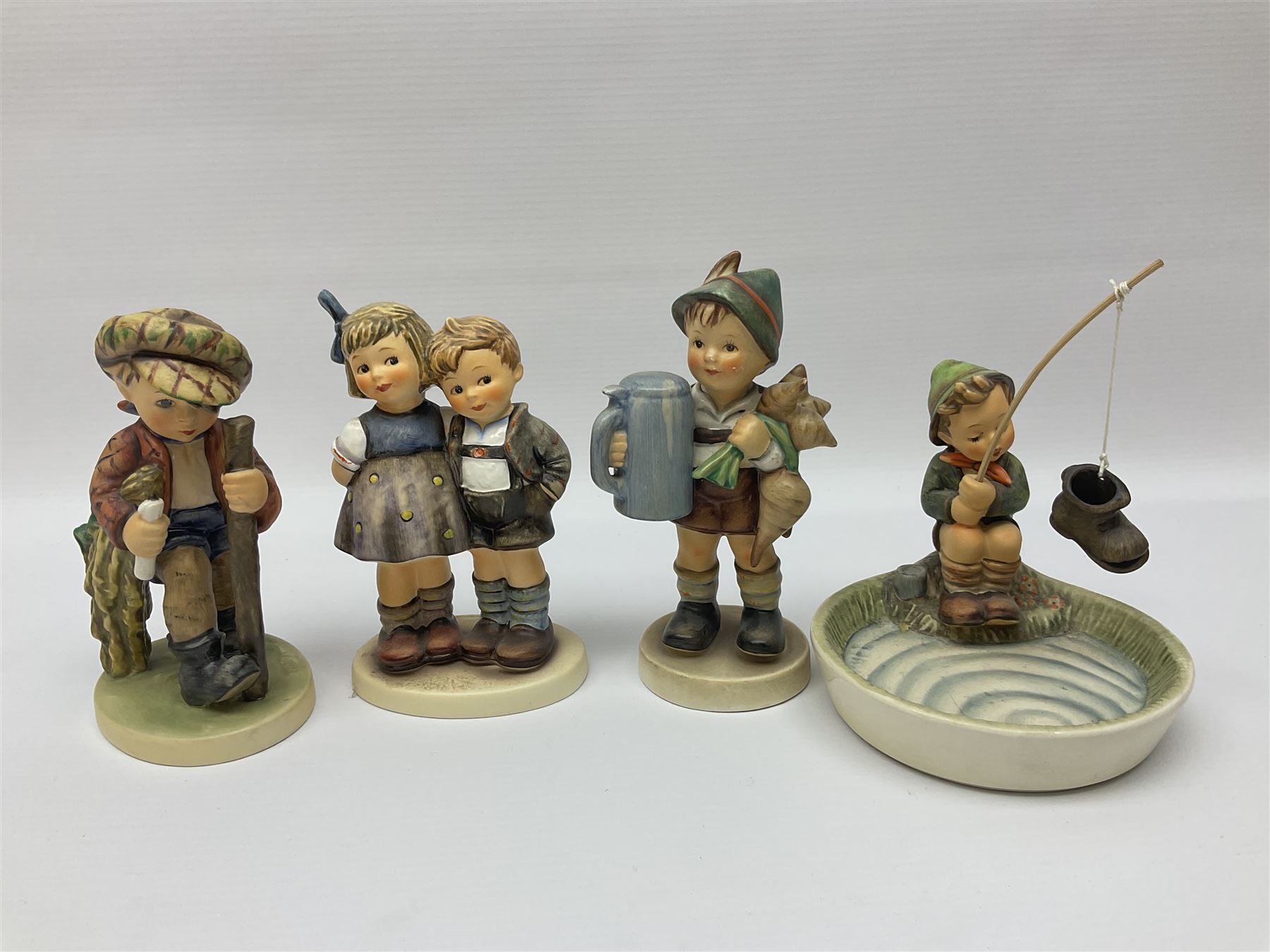 Twenty six Hummel figures by Goebel, to include Fire Fighter, Band Leader and Spring Sowing