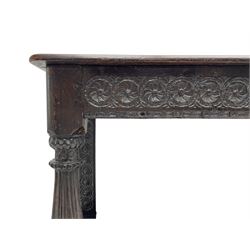 17th century oak buffet or side table, moulded rectangular top over guilloche carved frieze rails and rear upright supports, turned and flute carved front supports united by under tier
