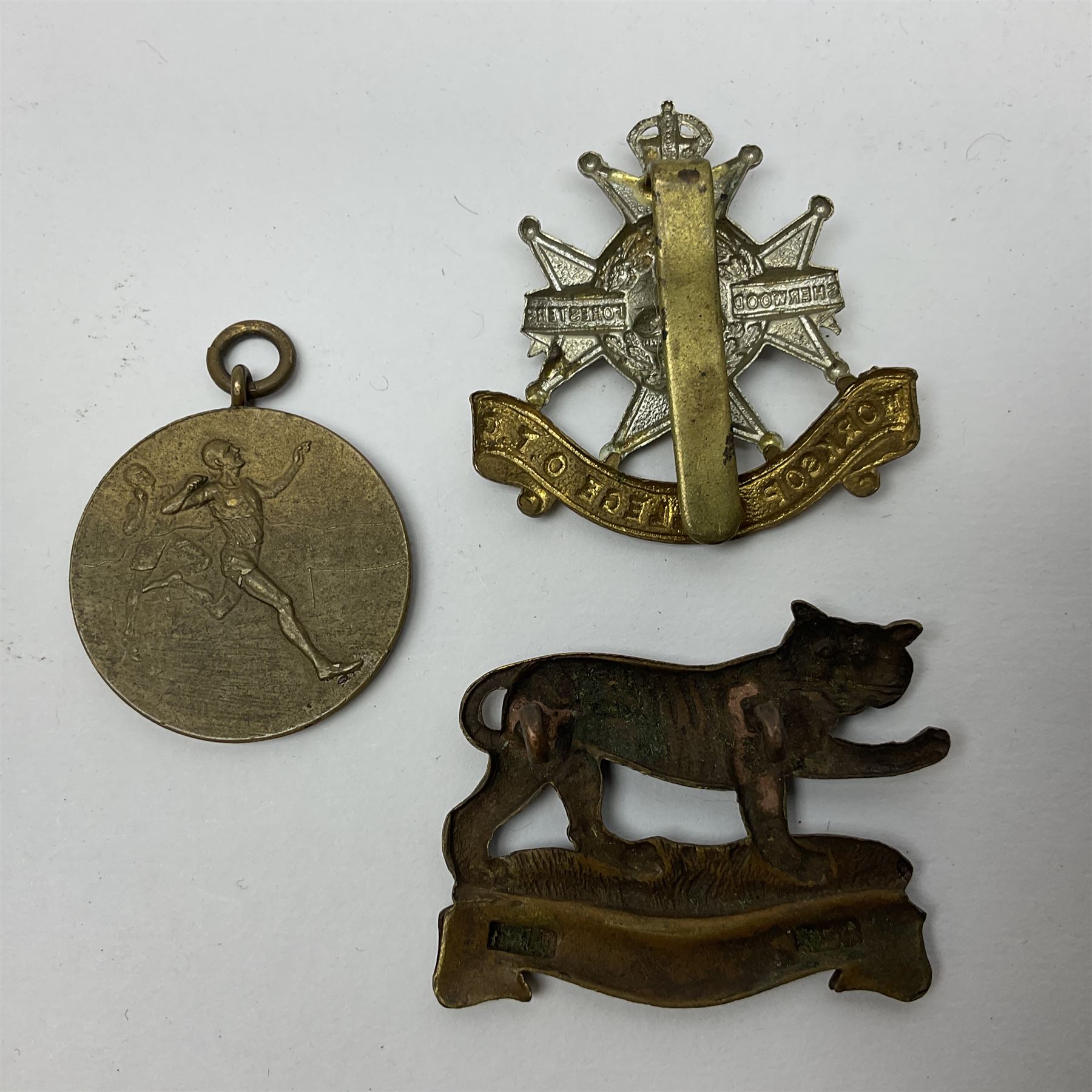 WW1 pair of medals awarded to 151761 Gnr. S. Loten R.A. with ribbons; four WW2 medals with ribbons; and small quantity of cap badges, medallions etc