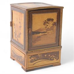 Desktop smokers cabinet, with an inlaid marquetry scene of Mount Fuji, the sides opening to reveal fitted pipe racks, H25cm