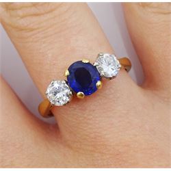 18ct gold three stone oval sapphire and round brilliant cut diamond ring, London 1991, total diamond weight approx 0.50 carat