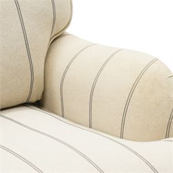 Pair of 20th century Howard shape armchairs, deep seat armchairs in cream and grep striped upholstery, raised on dark supports terminating in front castors
