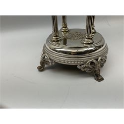 Early to mid 20th Century silver plated table centrepiece of circular form, with clear glass liner supported by bowl with pierced foliate design border raised upon four columns, with circular base supported by four scrolling feet with rams head masks, stamped with bird mark, possibly Phoenix Manufacturing Co. of Melbourne, H33cm