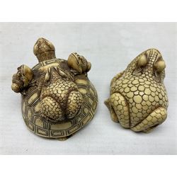 Two netsuke, comprising an example modelled with three frogs upon the shell of a tortoise together with a frog with scaled body, largest L8cm