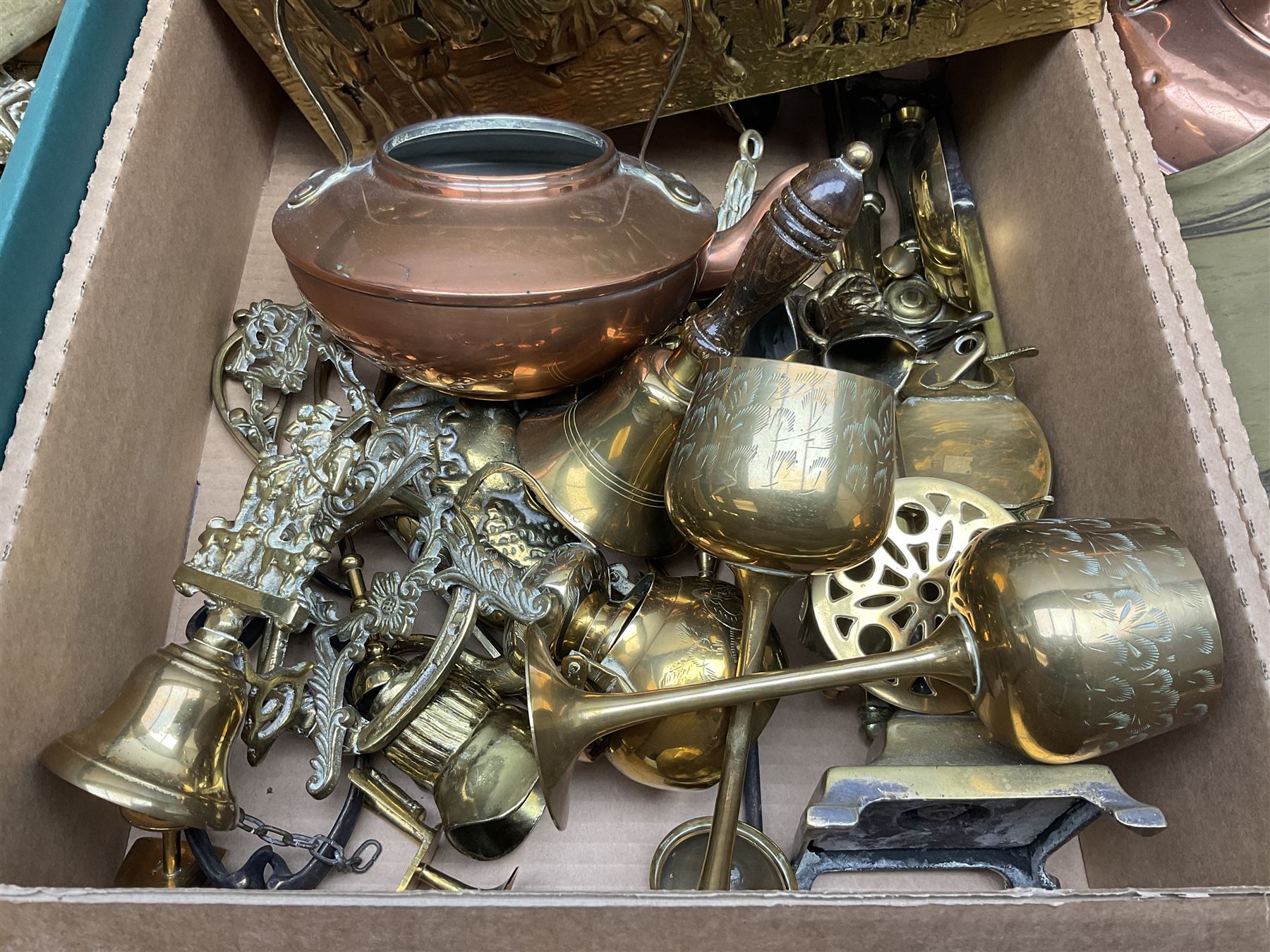 Quantity of copper pans and teapots, dish and sieve with pierced heart decoration and brass handle, together with quantity of brassware to include brass Art Nouveau crumb tray and brush, repousse chargers, fire tool accessories, decorative canon, sword and guns etc