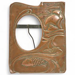 Newlyn type Arts and Crafts copper photograph frame decorated with a fish and galleon 24cm x 20cm with oval aperture and two other Newlyn style beaten copper frames (3)