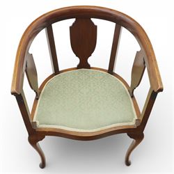 20th century mahogany tub chairs, the arched backs enclosing shaped splat panels and plain uprights, open curved arms flowing into the seat rails, upholstered seats in green foliate patterned fabric, on cabriole legs
