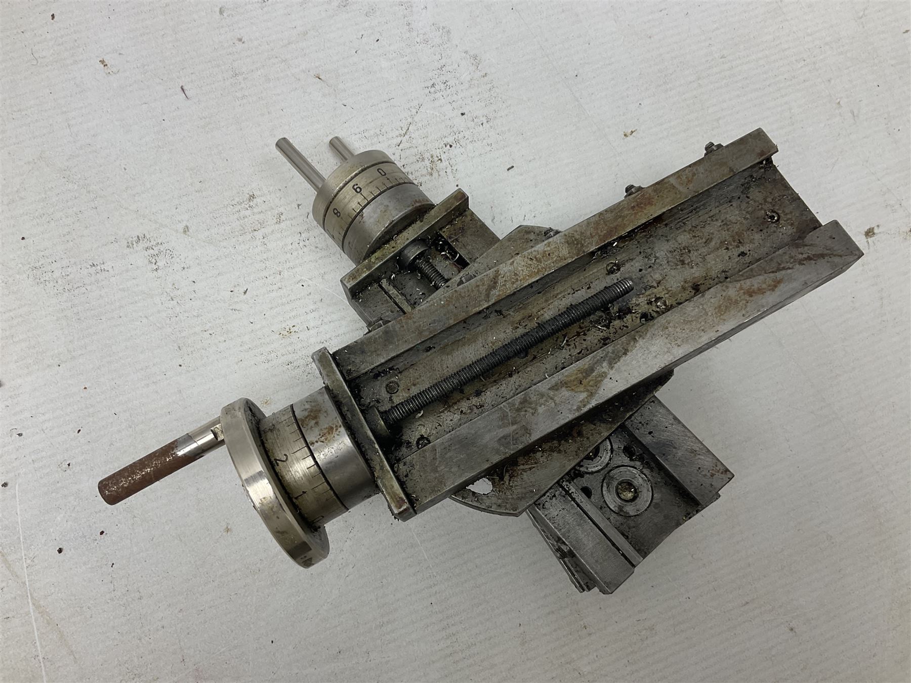 Cowells of Norwich model 90 modelmaker's lathe with handbook, the Pratt Bernard 4-jaw chuck with 4cm centre height and 7.5cm throw L44.5cm; together with an unrelated Hobbymat horizontal cross-slide with 4-way tool post (2)