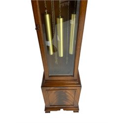 Late 20th century Grandmother clock with a chain driven Westminster chiming movement chiming the hours and quarters on 8 gong rods with strike silent facility, with a brass dial, silvered chapter ring, Roman numerals and pierced steel hands, in a mahogany case with a swans-neck pediment and fully glazed trunk door. With pendulum & three brass cased weights.