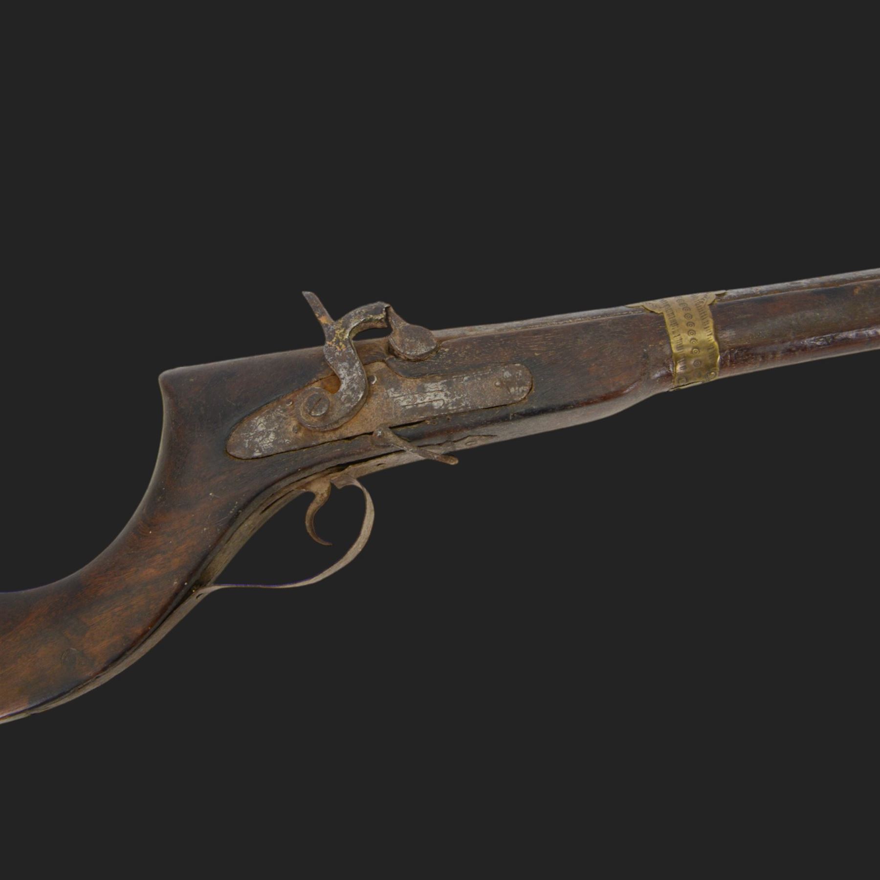 Middle Eastern percussion cap rifle, the 107cm  barrel with four brass bands and ramrod under, overall L143cm, together with another percussion rifle the 106cm barrel a copy of a 17th century Spanish barrel, complete with fake stamp, by vendors repute this rifle was confiscated from tribesmen in Kurdistan by police
Sold as an exempt item under Section 58 (2) of the 1968 Firearms Act, to be held as a curiosity or ornament