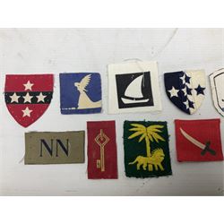 Approximately one-hundred printed and embroidered cloth badges including Royal Tank Regiment, Royal Armoured Corps, 219th Independent Infantry Brigade, Cyrenaica, Cyprus, Singapore and other districts, Gibraltar Garrison, East Anglian Brigade, 20th Armoured Brigade and various armoured divisions etc