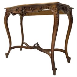French design walnut console table, shaped top with inset grey marble panel, the frieze pierced and carved with scrolling foliage and applied flower heads, raised on cabriole supports with cartouche carved knees, united by shaped X-stretcher