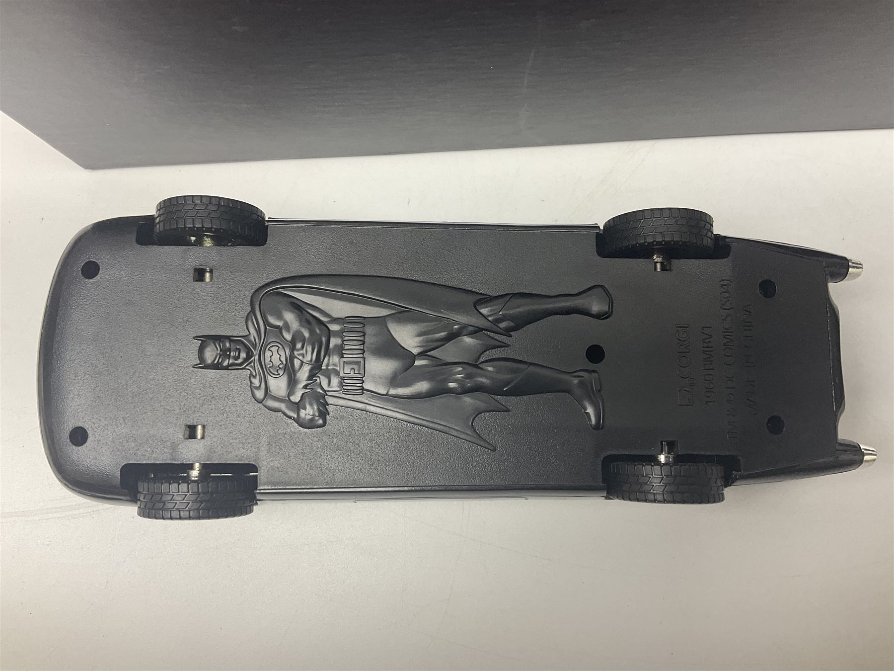 Two Corgi DC Comics die-cast Batmobiles comprising 1:18 scale die-cast Limited Edition Pre-Production Raw Metal Casting 1940 Batmobile Roadster no. 184/300, and 1:24 scale die-cast Limited Edition Raw Metal Casting 1960 Batmobile no. 858/1000, both with original boxes and certificates of authenticity 