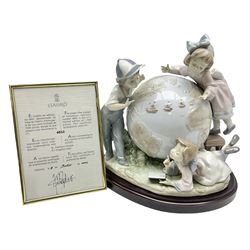 Lladro figure, Voyage of Columbus, modelled as children climbing on a globe, limited edition 6822/7500, sculpted by Francisco Polope, with original box, no 5847, year issued 1992, year retired 1993, H24cm
