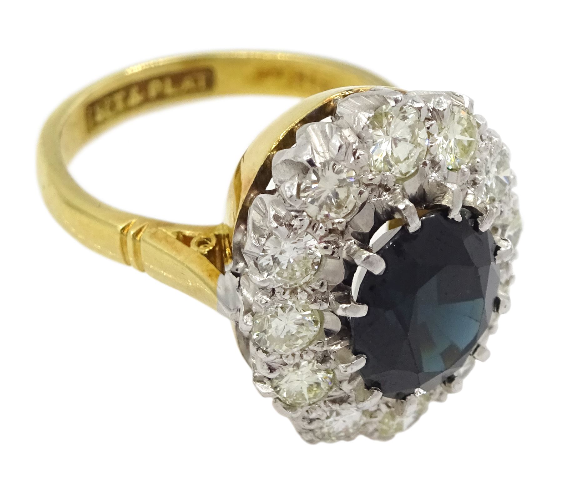 18ct gold and platinum oval sapphire and round brilliant cut diamond cluster ring, stamped, sapphire approx 2.80 carat, total diamond weight approx 1.00 carat and a 9ct gold band, hallmarked