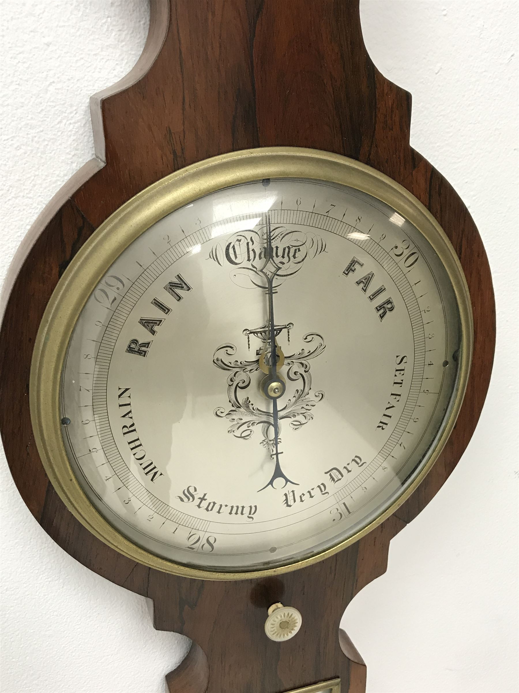 Early 19th century rosewood four dial banjo barometer, dry/damp dial, mercury thermometer, silvered circular register engraved with urn and scroll decoration, balance signed 'Vassalli Scarborough', fitted with mother of pearl adjusting handle