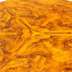 Dutch design figured walnut extending dining table, the shaped circular extending top with book-matched veneer and moulded edge, shaped banded frieze over scroll-moulded lower rail, raised on C-scroll carved cabriole supports with pad feet, with additional leaf