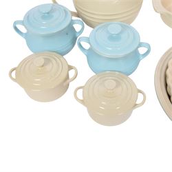Le Creuset ceramic kitchen wares in cream and light blue, including pie dishes, baking dishes, petit casseroles etc  