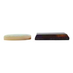 Loose rectangular black opal and a loose oval cabochon opal (2)

Notes: By direct decent from Barraclough family