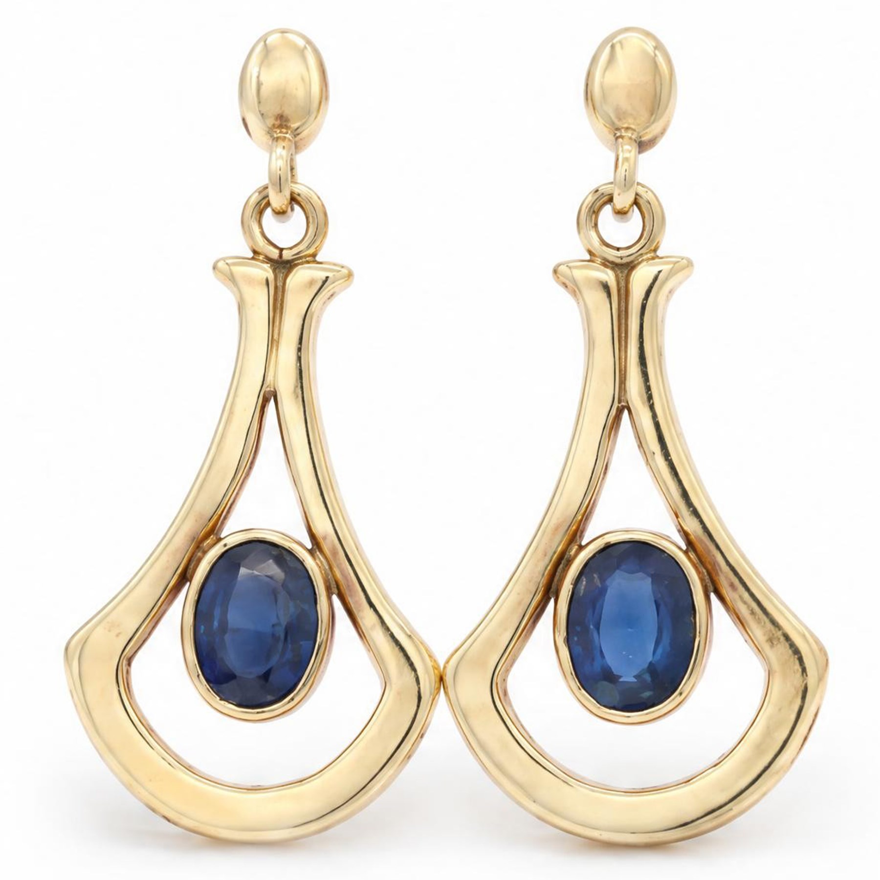 Pair of 9ct gold sapphire pendant earrings, each stud set with a single oval cut sapphire, in an openwork setting