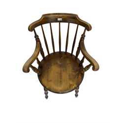 Early 20th century stained beech Captain's chair, comb back with scrolled arm terminals over penny seat, raised on turned supports