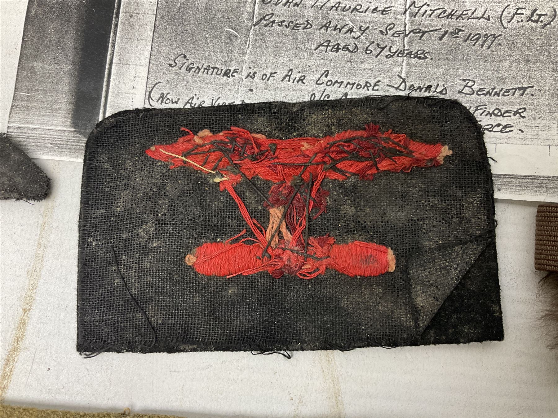 WW1 British Army Derby Scheme 1915 Attested armband; beret with East Yorkshire cap badge; pair of fur lined leather flying/motorcycle goggles; HMS Pembroke cap band; and small quantity of RNAS cloth and metal badges etc