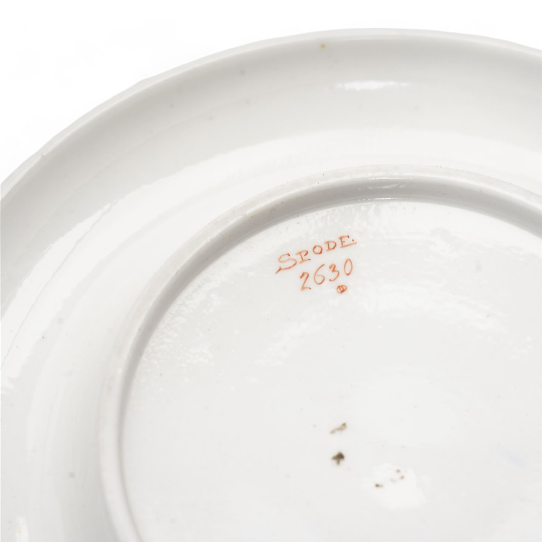 Early 19th century Spode spill vase, of cylindrical form with flared rim, hand painted with a Green Woodpecker perched on a branch, within beaded borders, titled beneath, H16cm, together with a Spode chocolate cup turnover rim stand, decorated in the imari pattern, no. 2630, painted marks beneath, D14cm (2)