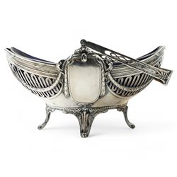 German standard 800 silver oval centrepiece with pierced sides, trailing harebells and swing handle, blue glass liner on splay feet L29cm Maker Wilhelm Binder