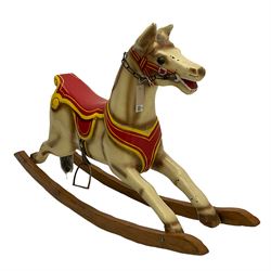 20th century rocking horse, painted body, glass eyes, metal stirrups and chain, wooden bow rocker