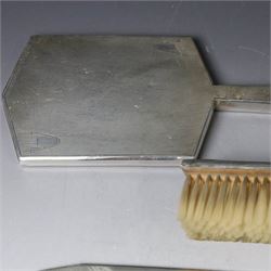 Mid 20th century silver mounted dressing table set, comprising hair brush, clothes brush, hand mirror and comb, each with engine turned Art Deco style decoration, all hallmarked Walker & Hall, Sheffield 1954 &1955