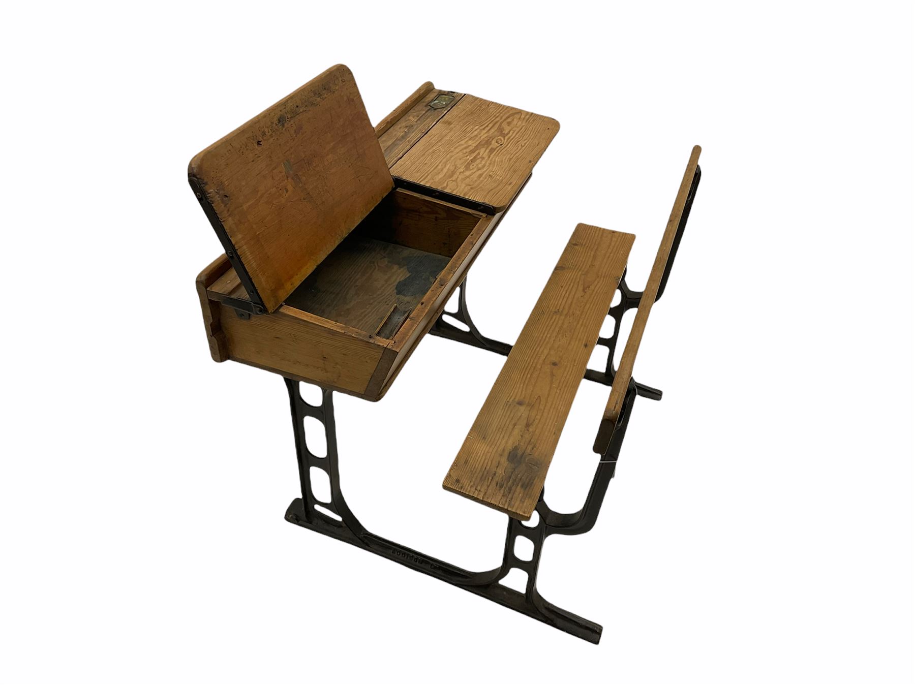 Early 20th century school desk, pine and cast iron, two sectional with hinged lids, the irons marked ‘Addision Ltd.’