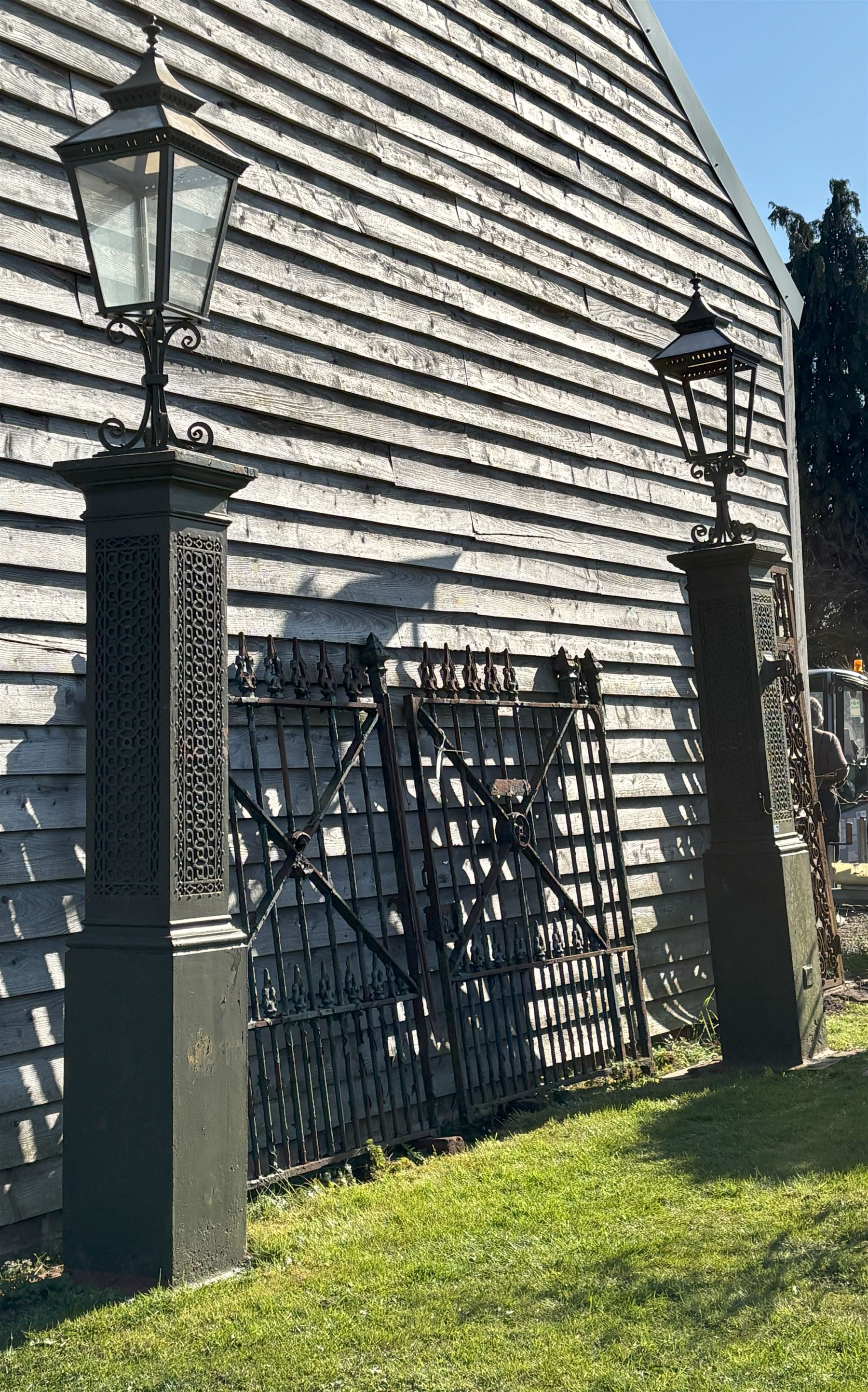 Impressive pair of 19th century cast iron gate piers by Coalbrookdale, each with a later lantern surmount on scrolled mount, above columns with blind fret strapwork decoration, on square section bases. Overall H350cm, Height excluding lanterns 220cm.  - COLLECTION BY APPOINTMENT FROM: The White House, Thirsk Road, Easingwold, York, YO61 3NF - CALL 01723 507111 TO ARRANGE