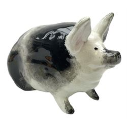 Early 20th century Wemyss seated pig, in black and white colouring, impressed mark beneath