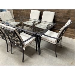 Metal framed garden table with glazed top (W170cm, D102cm, H71cm) and six armchairs with cushions 