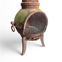 Garden chiminea, with mesh front spark guard, flue chimney on three splayed legs, in a weathered finish