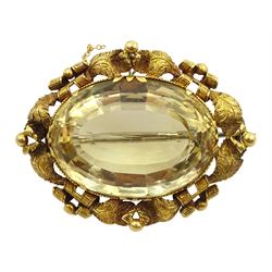 Large Victorian gold mounted citrine brooch, with leaf and scroll design surround
