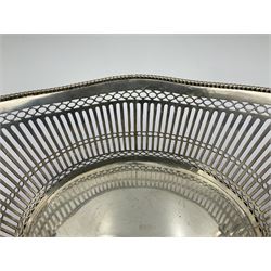 Early 20th century Dutch silver basket, of oval form with pierced sides, beaded rim, and twin handles, marked with Lion Passant for 2nd standard purity and date letter for 1910, other marks worn and indistinct, including handles H8.5cm L25.5cm