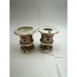 Pair of Staffordshire figures modelled as chained Dalmatians seated upon cobalt blue oval bases, H13cm, together with a Staffordshire pastille burner modelled as a castle, H12cm, a pair of 19th century Derby potpourri pots (lacking covers), and an 18th century blue and white tea bowl 