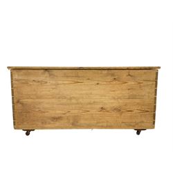 Victorian stripped pine blanket chest, rectangular hinged lid, on brass castors