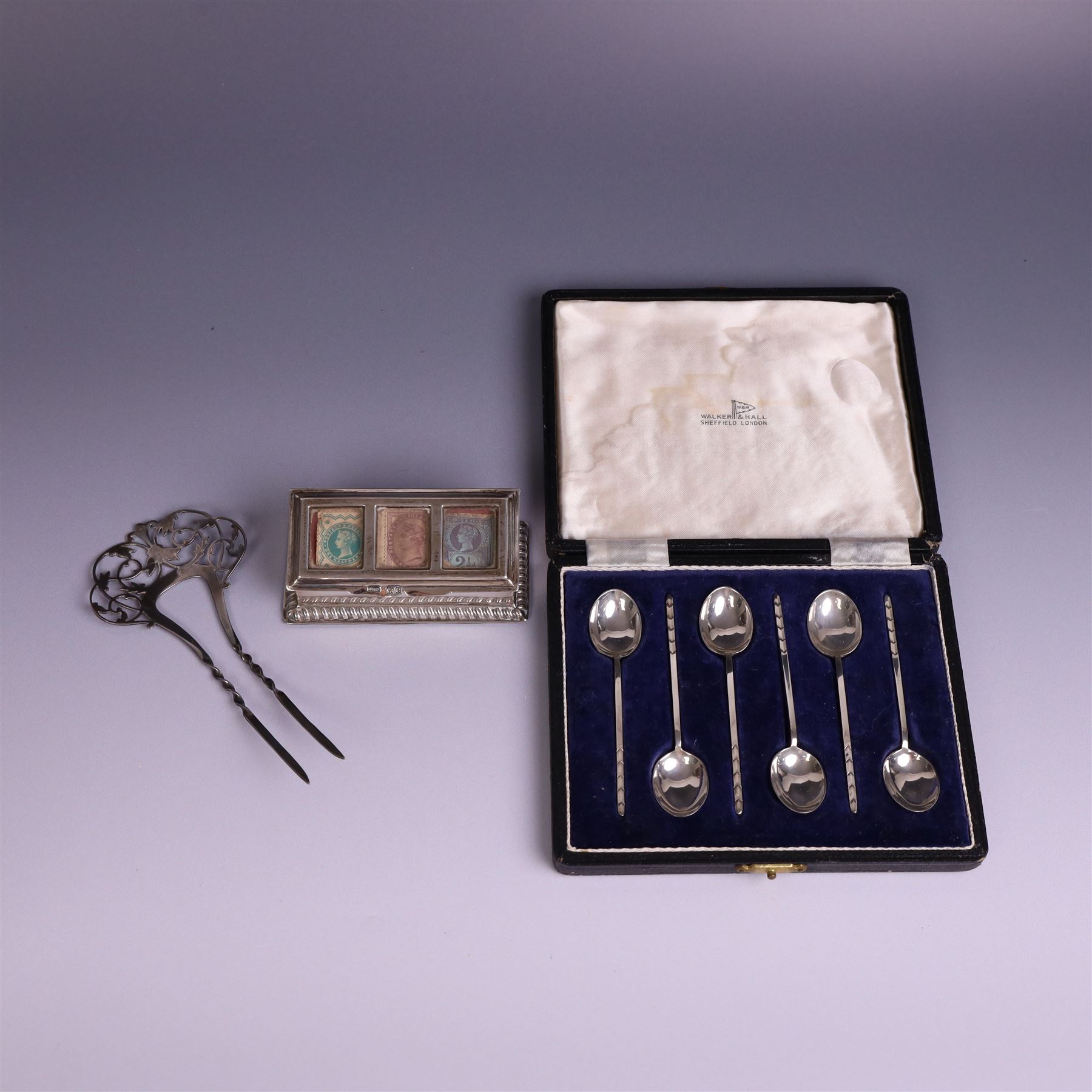 Late Victorian silver mounted stamp box, the hinged lid with three glazed panels, hallmarked Grey & Co, London 1900, together with a late Victorian silver hair comb and a cased set of six silver coffee spoons