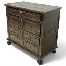 Late 17th-century oak chest, rectangular top above four graduated drawers with geometric panel mouldings, in two sections, supported on bun feet 
