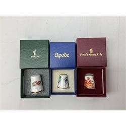 Quantity of thimbles to include twelve Irish Dresden lace examples, Royal Crown Derby, Spode, Portmeirion, Wedgwood, Royal Grafton etc, together with three display cases, many with certificates