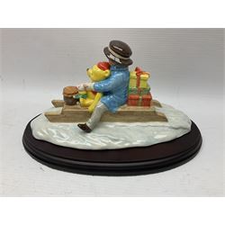 Nine Royal Doulton Winnie the Pooh Collection figures, including Oh Dear Bath Time's Here, Going Sledging, Tigger's Splash Time and Christopher Robin, together with a Royal Doulton Disney Showcase Jiminy Cricket figure, all boxed
