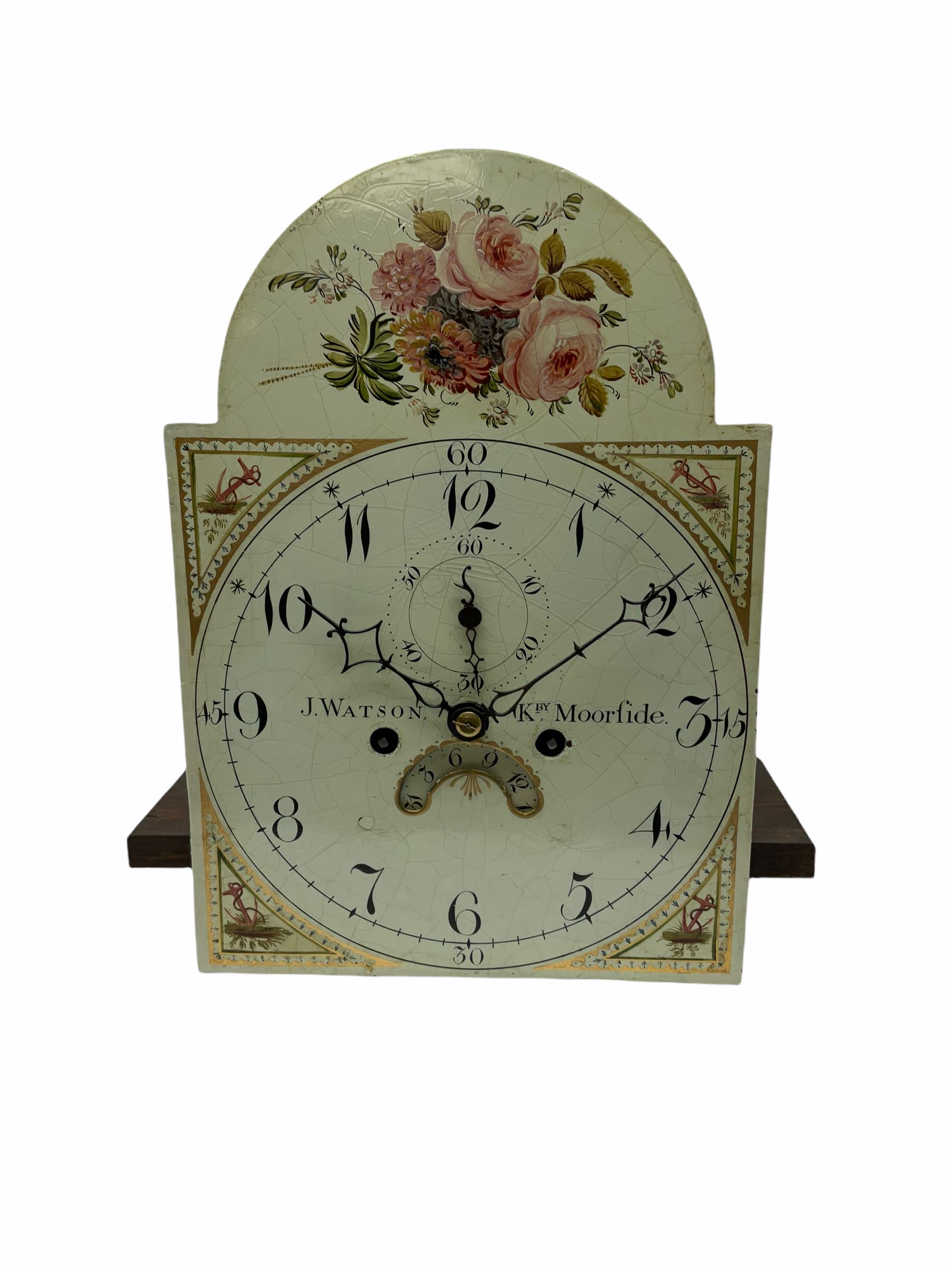 A 19th century mahogany longcase, hood with a swan’s neck pediment, brass patera and central finial, break arch hood door flanked by reeded pillars with brass Corinthian capitals and shaped back splats to the rear, trunk with a three-quarter length door and concave twin spire top, with stringing and a conch shell inlaid oval paterae, plinth with an applied shaped skirting and inlay, the 11” wide break arch painted dial with upright Arabic numerals, quarter hours and minute track, identical painted spandrels to the four corners and a representation of flowers and leaves to the arch, matching steel hour and minute hands with a steel second hand, highlighted semi-circular date aperture with the disc to the rear, dial pinned via a false plate to a four pillar 19th century eight-day rack striking movement striking the hours on a bell, weight driven trains with a recoil anchor escapement, dial inscribed “Watson, Kirby Moorside”.
With weights and pendulum.
