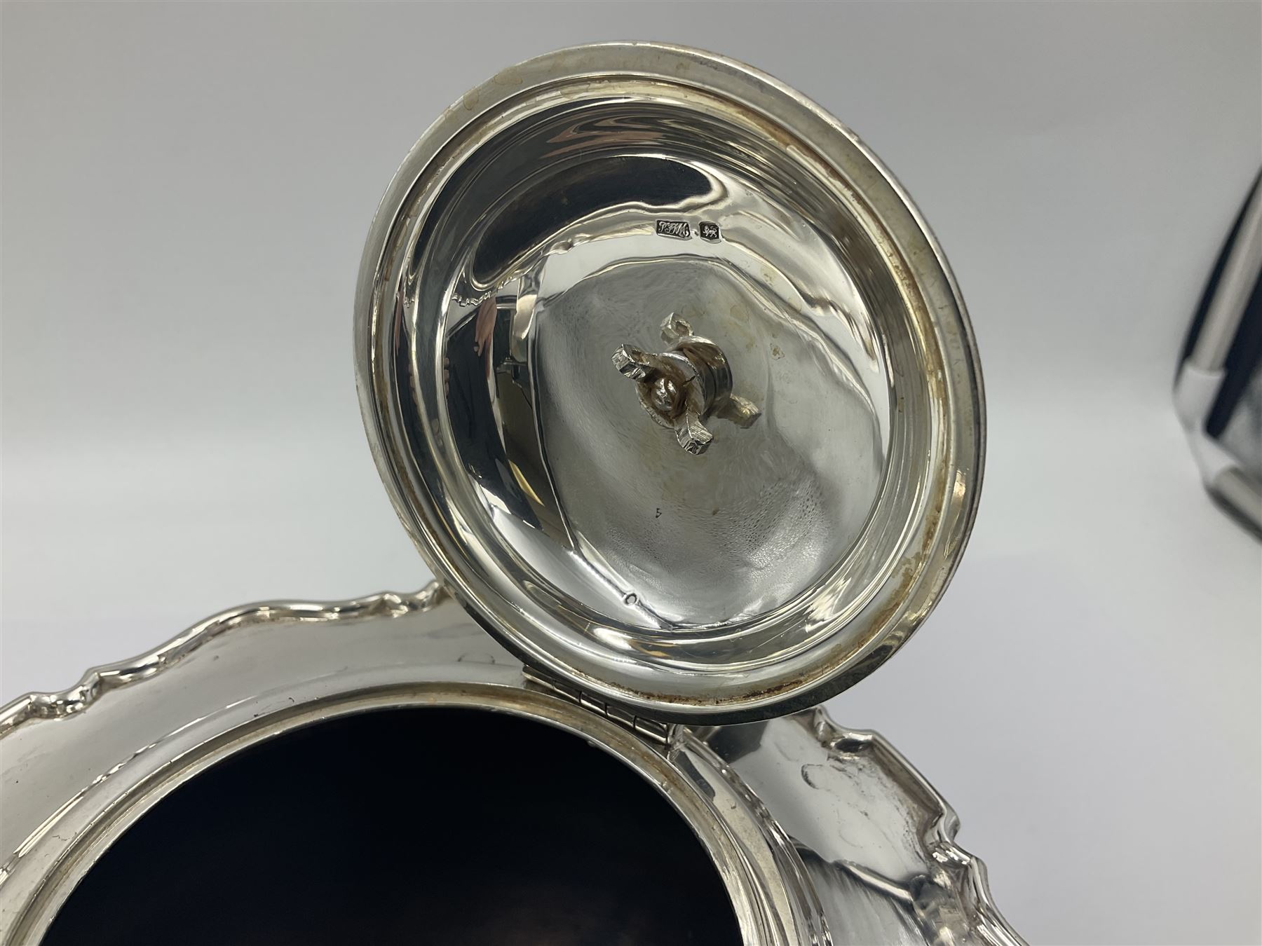 1920s five-piece silver tea service, comprising teapot, coffee pot, hot water pot, twin handled open sucrier and milk jug, each of squat circular form with shaped rim, the teapot, coffee pot and hot water pot each with ebonised handle and finial, the sucrier and milk jug with acanthus capped scroll handles, all upon circular foot, hallmarked R F Mosley & Co, Sheffield 1926 & 1927, tallest H24cm