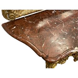 19th century giltwood and gesso console table, shaped variegated rouge marble top with moulded edge, central shell motif with extending scrolled foliage, on foliate and flower head moulded cabriole supports united by pierced shell middle rail, scrolled acanthus leaf terminals 
