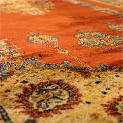 Persian Kashan prayer rug, rust red field with mihrab arch design, suspended floral hanging lamps, and a central flowering vase framed by columnar supports enclosed by palmette and meandering vine border