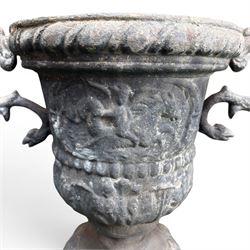 Impressive pair of early highly decorative lead garden urns, griffin handles with ornate decoration depicting cherubs and laurel wreath